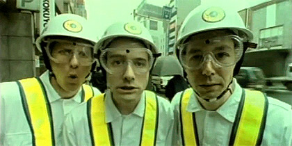 Members of the Beastie Boys from the Intergalactic music video in overalls